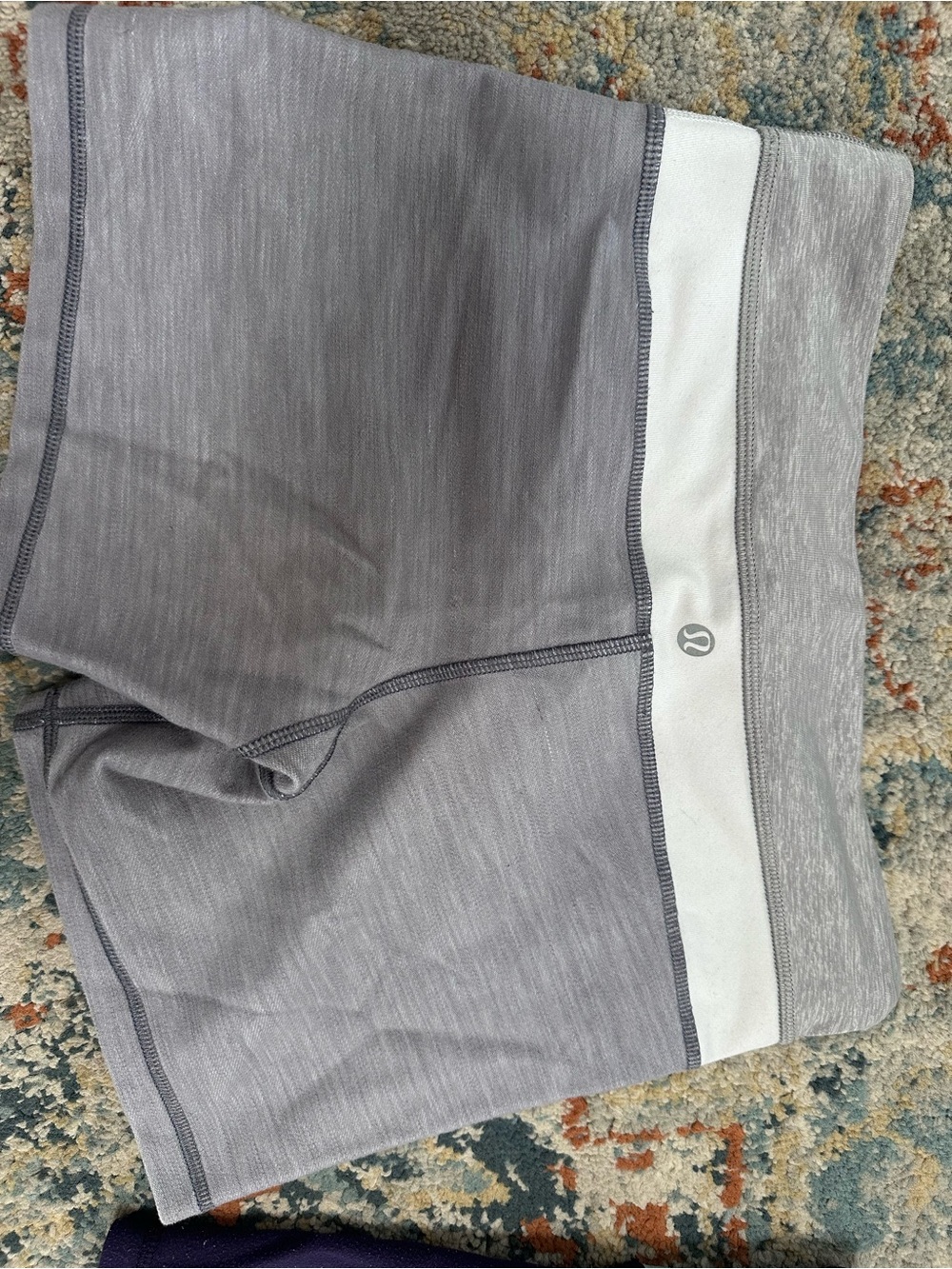 Lululemon light gray with white stripe 4” shorts. Great condition. XS size 2